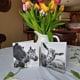 two black and white greeting cards and a jug of tulips