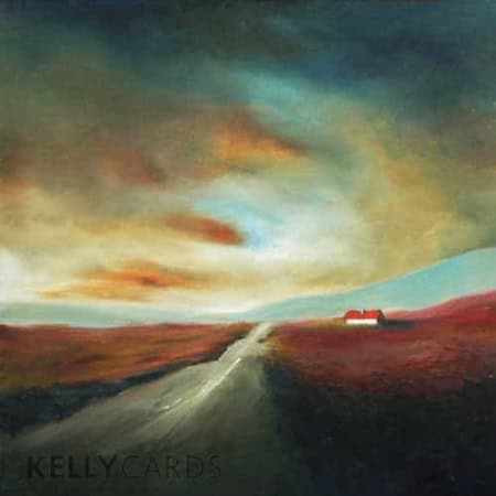 road stretching into the distance with a wispy sky reflecting the colour from the land
