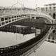 black and white photograph of the Ha'pennt bridge in Dublin early in the morning with no people